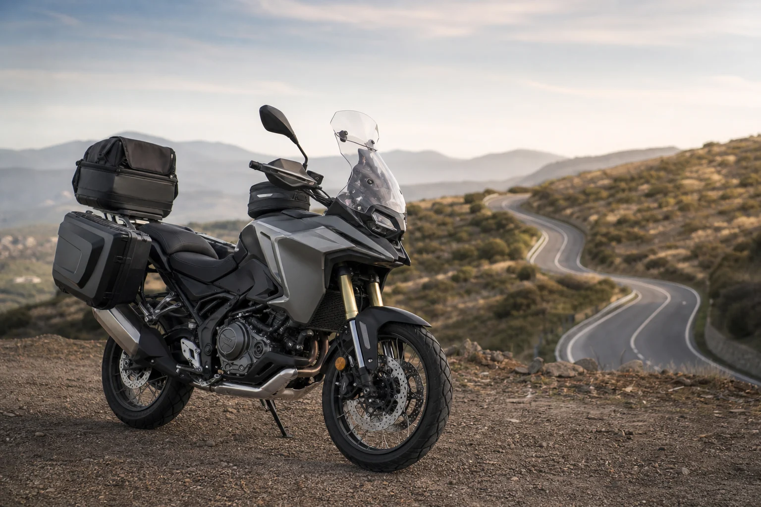 Road motorcycle parked with side cases, a top case and a tank bag for a trip